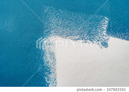 half blue and white painted wall texture half blue and white painted wall texture 107883581