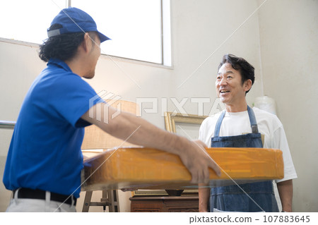 A man who delivers parcels or parcels A man who delivers parcels or parcels 107883645
