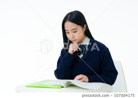 Female student studying for entrance exam Female student studying for entrance exam 107884175