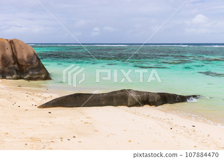 Anse Union beach view, landscape with rocks on empty coast, Seychelles Anse Union beach view, landscape with rocks on empty coast, Seychelles 107884470