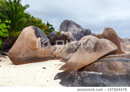 Seychelles beach Landscape with coastal rocks on white sand. La Digue Seychelles beach Landscape with coastal rocks on white sand. La Digue 107884476