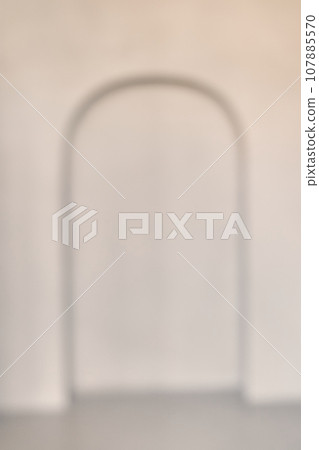 A defocused empty white interior room with a recess in the back wall, modern architecture or the background of a product presentation template. High quality photo A defocused empty white interior room with a recess in the back wall, modern architecture or the background of a product presentation template. High quality photo 107885570
