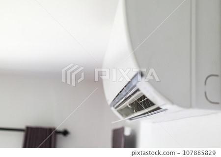 Air conditioner on white wall room interior background 107885829
