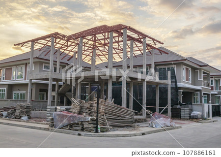 construction residential new house in progress at building site construction residential new house in progress at building site 107886161