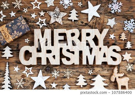 Text Merry Christmas With Wooden Winter And Christmas Background Text Merry Christmas With Wooden Winter And Christmas Background 107886400