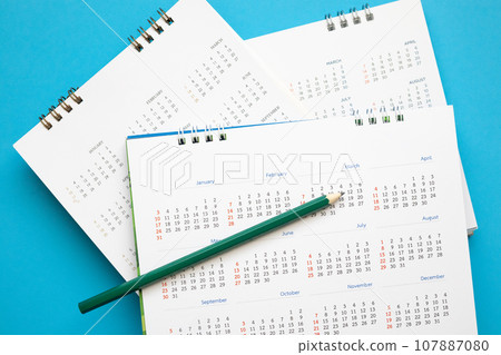 calendar page with pencil close up on blue background business planning appointment meeting concept calendar page with pencil close up on blue background business planning appointment meeting concept 107887080