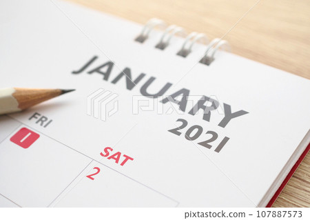 January month on 2021 calendar page with pencil business planning appointment meeting concept January month on 2021 calendar page with pencil business planning appointment meeting concept 107887573