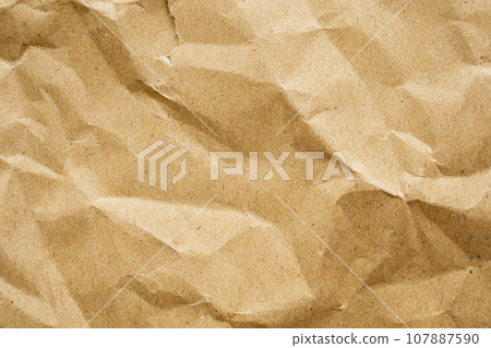 Brown crumpled paper recycled kraft sheet texture background Brown crumpled paper recycled kraft sheet texture background 107887590