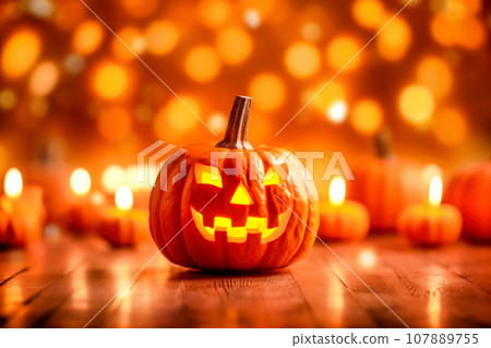 Halloween pumpkin with candlelight and bokeh background 107889755