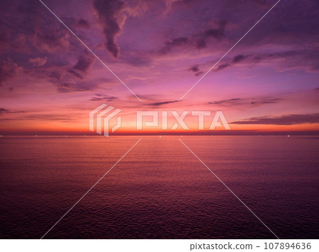 Aerial view sunset sky over sea,Nature Light Sunset or sunrise over ocean,Colorful dramatic scenery sky, Amazing clouds and waves in evening sky, Beautiful light nature background Aerial view sunset sky over sea,Nature Light Sunset or sunrise over ocean,Colorful dramatic scenery sky, Amazing clouds and waves in evening sky, Beautiful light nature background 107894636