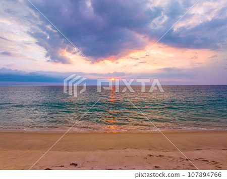 Aerial view sunset sky over sea,Nature Light Sunset or sunrise over ocean,Colorful dramatic scenery sky, Amazing clouds and waves in evening sky, Beautiful light nature background 107894766