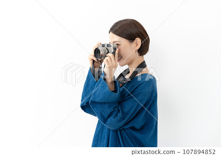 A woman with a camera A woman with a camera 107894852