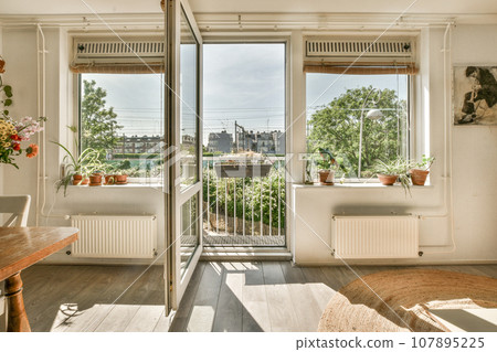 a living room with wooden floors and large windows looking out onto the cityscapearl view from inside 107895225
