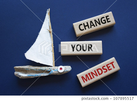 Change your mindset symbol. Concept words Change your mindset on wooden blocks. Beautiful deep blue background with boat. Business and Change your mindset concept. Copy space. Change your mindset symbol. Concept words Change your mindset on wooden blocks. Beautiful deep blue background with boat. Business and Change your mindset concept. Copy space. 107895517