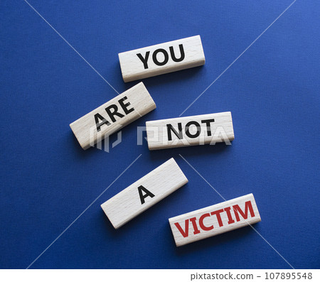 You are not your a victim. Wooden blocks with words You are not a victim. Beautiful deep blue background. Business and You are not a victim. Copy space. You are not your a victim. Wooden blocks with words You are not a victim. Beautiful deep blue background. Business and You are not a victim. Copy space. 107895548