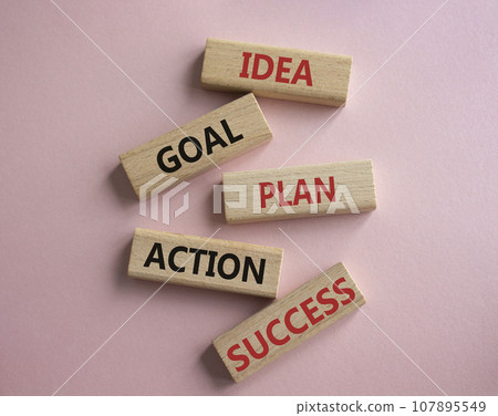 Idea Goal Plan Action Success symbol. Concept words Idea Goal Plan Action Success on wooden blocks. Beautiful pink background. Business concept. Copy space. Idea Goal Plan Action Success symbol. Concept words Idea Goal Plan Action Success on wooden blocks. Beautiful pink background. Business concept. Copy space. 107895549