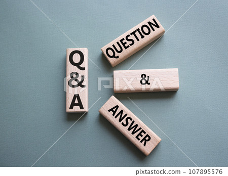 Q and A - Question and Answer. Wooden cubes with words Q and A. Beautiful grey green background. Business and Q and A concept. Copy space. 107895576