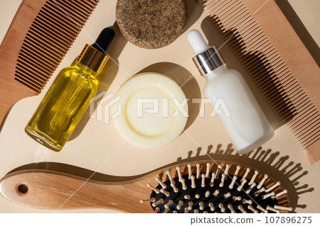 Natural Hair Care Concept - Solid Shampoo, Oils and Serums, Wooden Combs Natural Hair Care Concept - Solid Shampoo, Oils and Serums, Wooden Combs 107896275