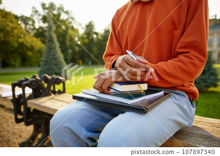 Student holding personal studying accessories high angle closeup view 107897340