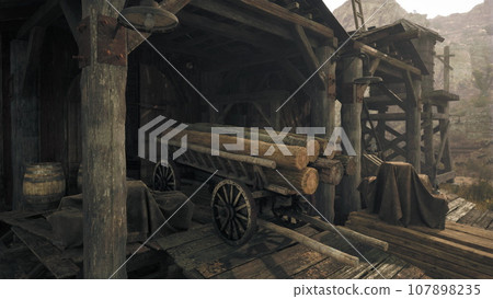 An antique wooden building with a vintage wooden wagon in the foreground 107898235