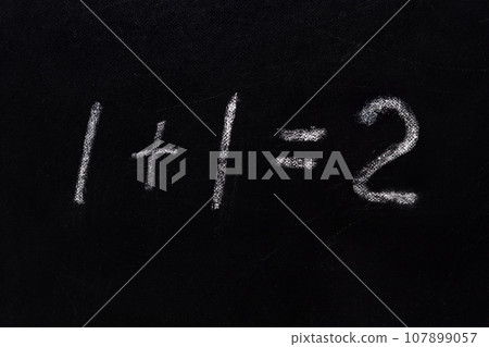 Simple math equation 1 1 2 written school board chalk. Blackboard equations one plus one equals two written black board background. 1 plus 1 equals 2 writing chalkboard background. Elementary school Simple math equation 1 1 2 written school board chalk. Blackboard equations one plus one equals two written black board background. 1 plus 1 equals 2 writing chalkboard background. Elementary school 107899057