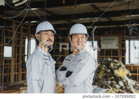 Workers working at a demolition site Workers working at a demolition site 107899882