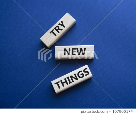 Try new Things symbol. Concept words Try new Things on wooden blocks. Beautiful deep blue background. Business and Try new Things concept. Copy space. Try new Things symbol. Concept words Try new Things on wooden blocks. Beautiful deep blue background. Business and Try new Things concept. Copy space. 107900174