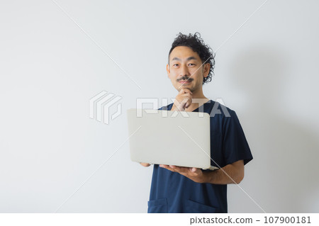 Doctor with tired expression Doctor with tired expression 107900181