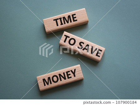 Time to save money symbol. Wooden blocks with words Time to save money. Beautiful grey green background. Business and Time to save money concept. Copy space. Time to save money symbol. Wooden blocks with words Time to save money. Beautiful grey green background. Business and Time to save money concept. Copy space. 107900184