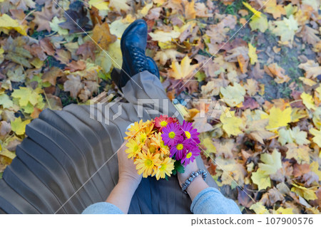 Autumn lifestyle with woman hands close up Autumn lifestyle with woman hands close up 107900576