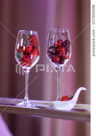 Fruit-filled wine glasses on silver tray Fruit-filled wine glasses on silver tray 107900986