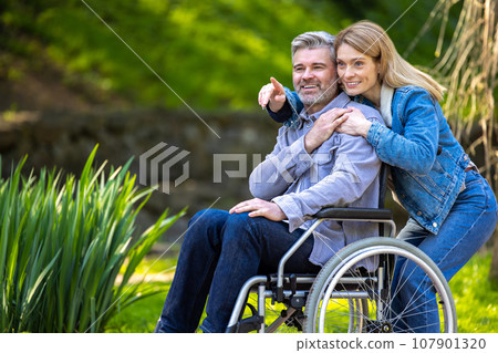 Happy smiling couple on a walk in the park 107901320