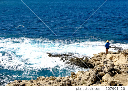 Fisherman at Caves of Ajuy - Fuerteventura, Canary Islands, Spain 107901420