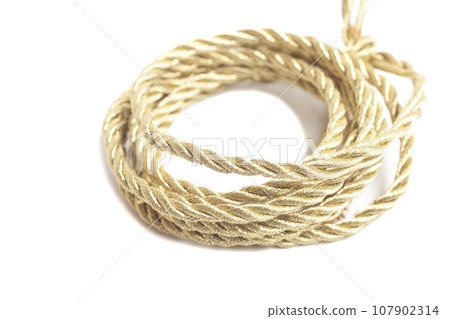 Golden rope isolated on a white background Golden rope isolated on a white background 107902314