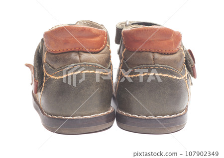Children's shoes isolated white background. Children's shoes isolated white background. 107902349