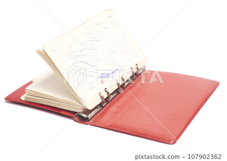 Open old red notepad from 80s 107902362