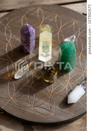 Healing crystals on brown background Healing crystals on brown background 107902675