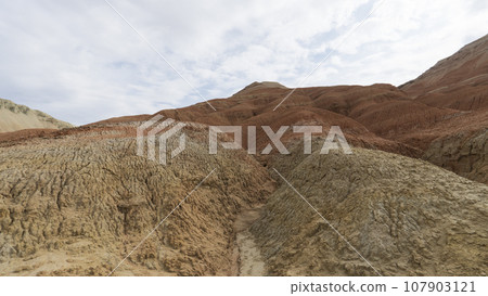 Colorful high mountains and a canyon made of clay Colorful high mountains and a canyon made of clay 107903121