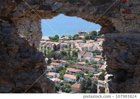 A glimpse of the ruins of the mausoleum of Tredoliche. landscape from the uins of Cirella, an abandoned village for a century in the Calabria region in Italy A glimpse of the ruins of the mausoleum of Tredoliche. landscape from the uins of Cirella, an abandoned village for a century in the Calabria region in Italy 107903824