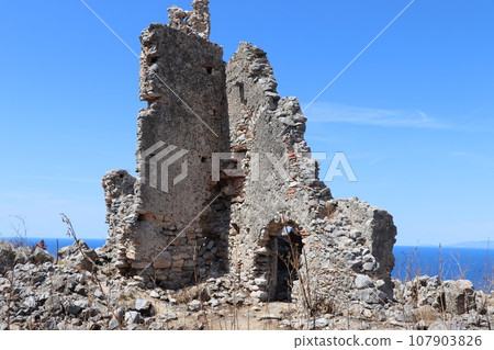 A glimpse of the ruins of the mausoleum of Tredoliche. landscape from the uins of Cirella, an abandoned village for a century in the Calabria region in Italy A glimpse of the ruins of the mausoleum of Tredoliche. landscape from the uins of Cirella, an abandoned village for a century in the Calabria region in Italy 107903826
