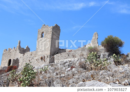 A glimpse of the ruins of the mausoleum of Tredoliche. landscape from the uins of Cirella, an abandoned village for a century in the Calabria region in Italy A glimpse of the ruins of the mausoleum of Tredoliche. landscape from the uins of Cirella, an abandoned village for a century in the Calabria region in Italy 107903827