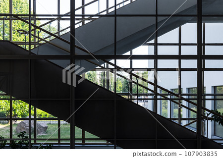Abstract industrial interior background with a stairway Abstract industrial interior background with a stairway 107903835