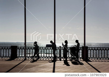 Walk in autumn at sunset 107903920