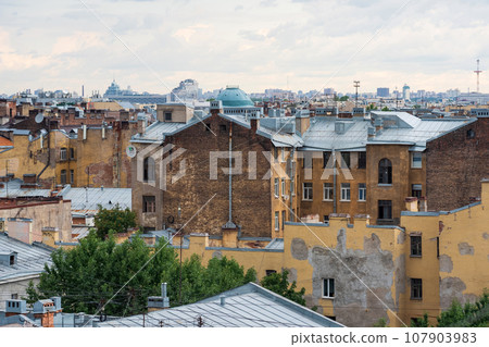 view of the roofs of the historical center of St. Petersburg on a cloudy day 107903983