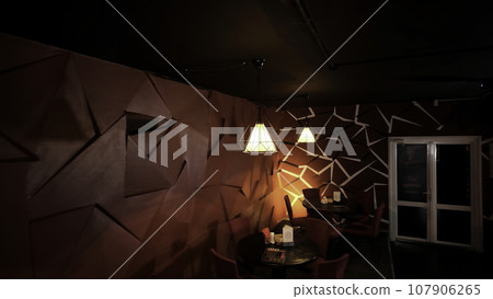 Red dark room with lamps and contemporary design. Clip. Small room of a night bar. Red dark room with lamps and contemporary design. Clip. Small room of a night bar. 107906265