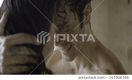 Passionate young sexy couple embracing naked with wet hair. Action. Loving man and woman together. Passionate young sexy couple embracing naked with wet hair. Action. Loving man and woman together. 107906386