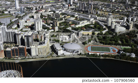 View of small fountains taken from a helicopter. Stock footage. Summer time with fountains and small houses and green parks around. View of small fountains taken from a helicopter. Stock footage. Summer time with fountains and small houses and green parks around. 107906560