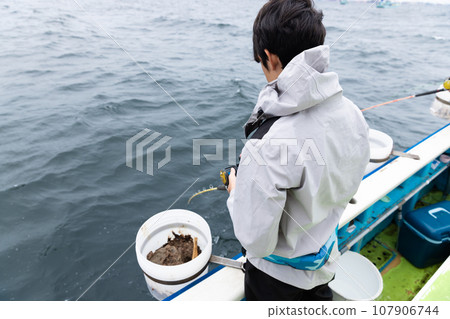 boy enjoying sea fishing 107906744