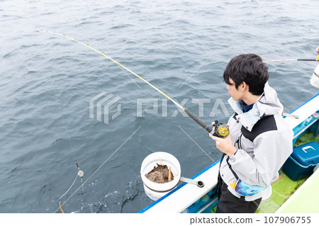 boy enjoying sea fishing boy enjoying sea fishing 107906755