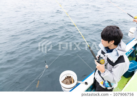 boy enjoying sea fishing boy enjoying sea fishing 107906756